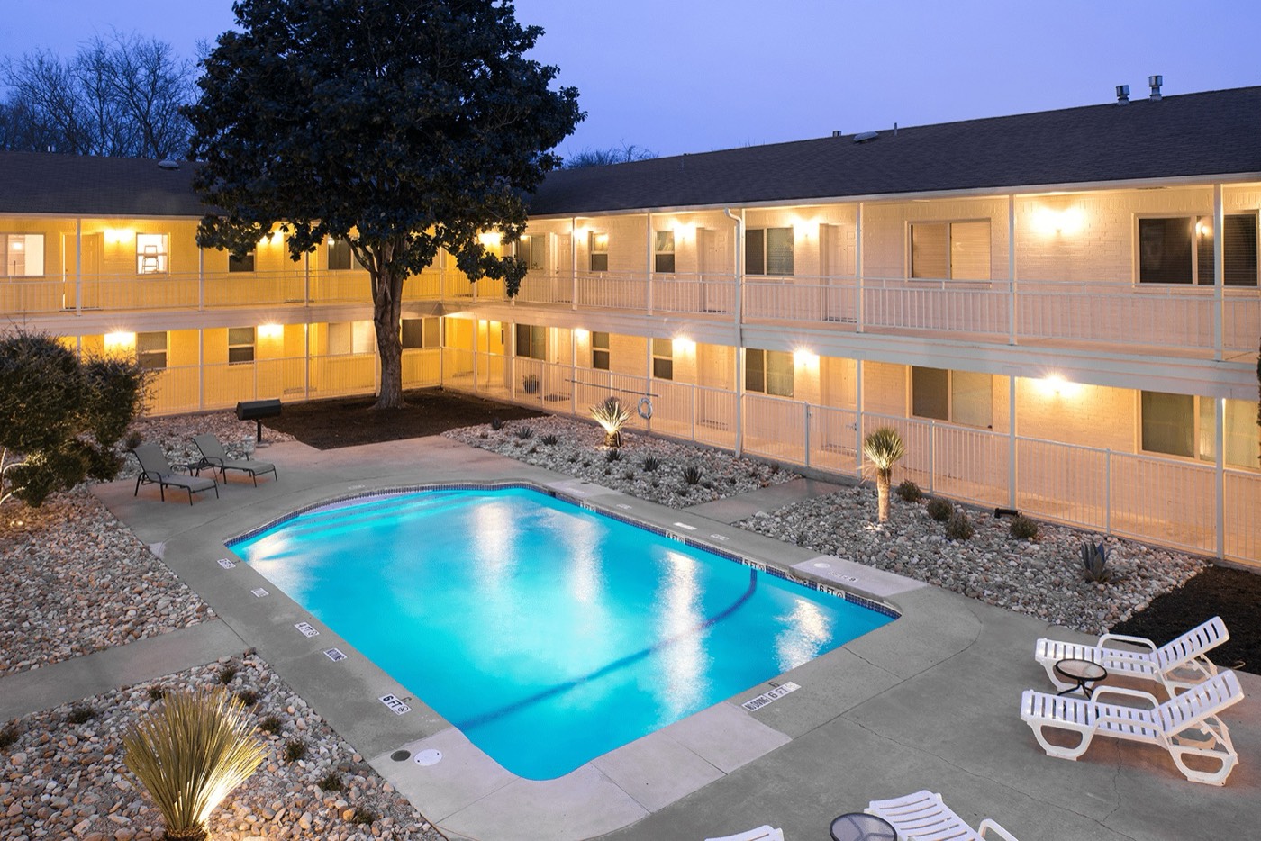 Swimming pool and courtyard at dusk